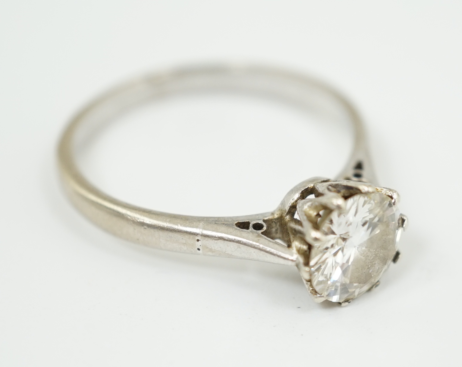 A white gold and solitaire diamond set ring